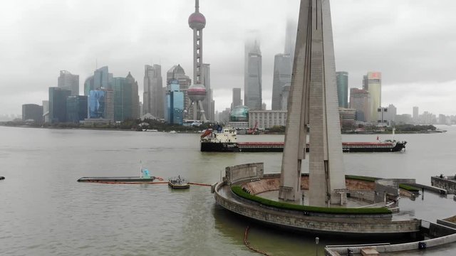 Rising aerial over the peoples heroe monument Shanghai Bund