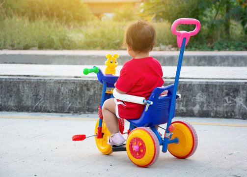 Baby on online tricycle