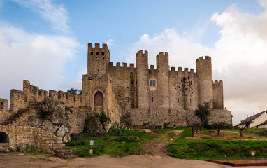 Fototapeta na wymiar OBIDOS, PORTUGAL - NOVEMBER 20, 2018: The castle and wall of Óbidos it is currently a pousada (hotel)