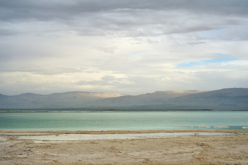 Obraz premium Dead Sea and overcast sky in cloudy weather