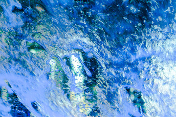 blue and teal water splashing abstract background
