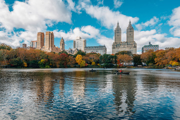 Buildings in the Upper West Side and autumn color along The Lake, in Manhattan, New York City