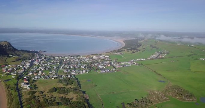 Stunning panoramic flight over Stanley towards huge rock in Tasmania, Australia