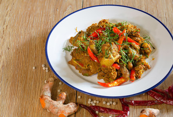 Stir fried cartilage pork with spicy curry paste (Thai call *Kua Kling*) thai food, in white dish..