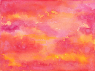 watercolor background in pink orange yellow and purple colors in a beautiful abstract painted sunrise or sunset with clouds in artist design