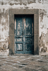 A rustic door at Castel Sant'Elmo, in Naples, Italy