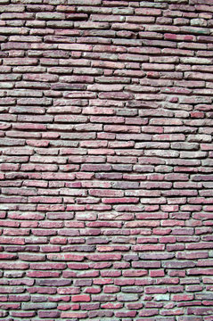 Small red brick wall of red color