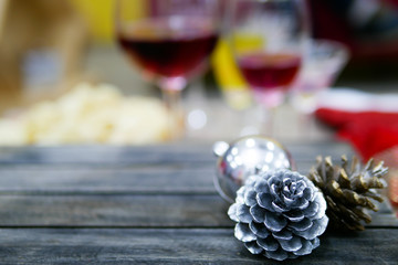 Christmas and New Year background with wine and decoration on dark modern brown wooden board