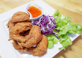 fried chicken wing / batter fried chicken crispy on white plate chilli spicy sauce