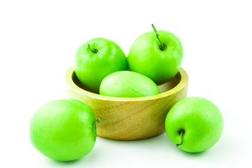 apple monkey or jujub (Zizyphus mauritiana Lam) isolated green fruit in wooden cup on white background and clipping path.