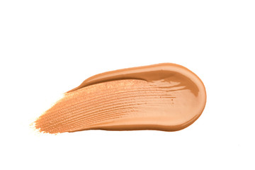 Light beige makeup smear of creamy foundation isolated on white background. Light beige creamy foundation texture isolated on white background