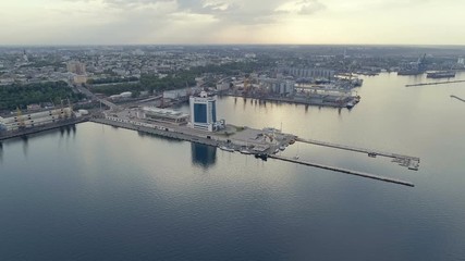Aerial of Odessa seaport with lengthy piers, ships and Potemkin Stairs in summer