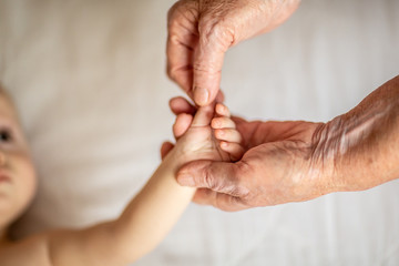 closeup of senior couple holding hands