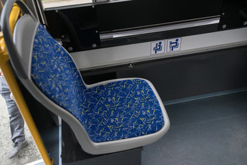 Modern city bus interior and seats. Public transport