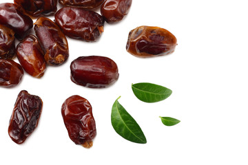 date fruits with green leaves isolated on white background. top view