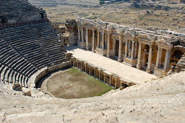 Roman amphitheater and the ruins of the old city of Hierapolis. Pamukkale, Turkey. Autumn, daytime photo.