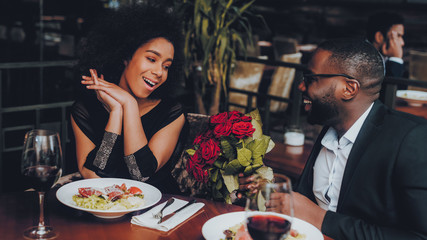 African American Couple Dating in Restaurant