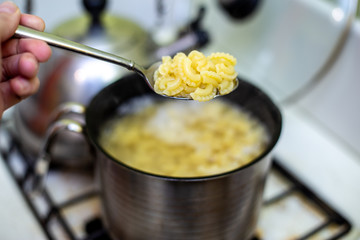 Pasta is cooked in a saucepan