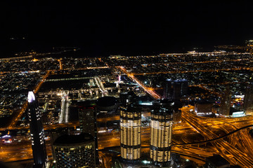 Fototapeta premium Night Dubai from the 125th floor of the Burj Khalifa Tower.
