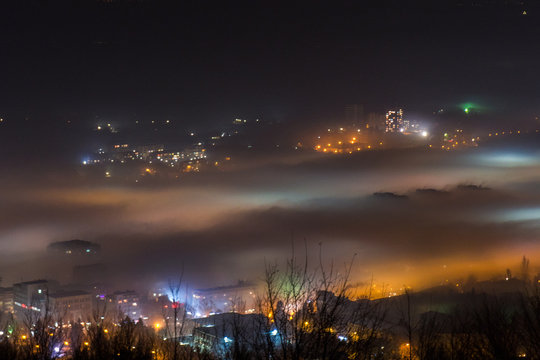 City under a thick fog shot from above