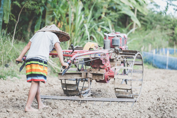 Poor children are forced to work in agricultural areas. Violence child and trafficking concept,Anti-child labor, Rights Day on December 10.