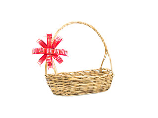 Fototapeta na wymiar Empty wicker basket with red and gold ribbon isolated on white background