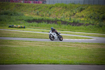 Moto-athlete on the racetrack.