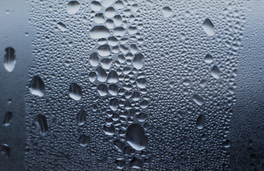 texture of wet drops on the glass. thaw
