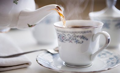 Tea Pot Pouring Hot Steaming Tea Close Up