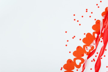 Background wit red ribbon and bright hearts for Valentine day decoration