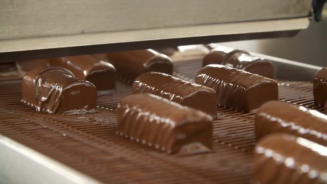 Chocolate sweets on the conveyor belt
