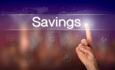 Naklejka premium A hand selecting a Savings business concept on a clear screen with a colorful blurred background.