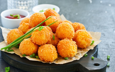 cheese balls with tomato sauce.