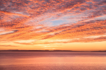 Sunrise Mackeral Sky with Cirrocumulus Clouds over the Sea