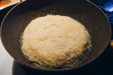 Home cooking Kunefe fried in a pan