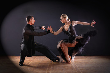 dancers in ballroom isolated on black background