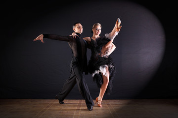 dancers in ballroom isolated on black background