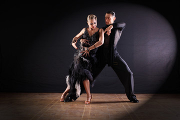 dancers in ballroom isolated on black background