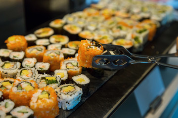 Variety Sushi roll pick with stainless tongs