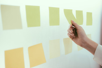 Business people meeting and use post it notes to share idea.