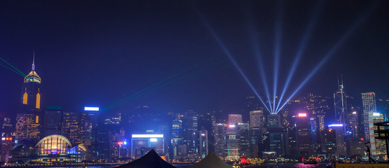 View Night of Symphony of Lights and two boat of life at Victoria Harbor in Hong Kong.