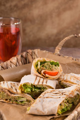 Pieces of vegetarian falafel roll on a wicker tray. Serving dishes.. Traditional Middle Eastern snack. Fastfood.