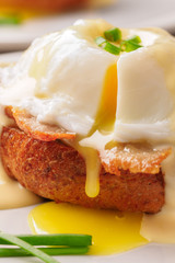 Breakfast is Eggs Benedict - toasted English muffins, bacon, ham, poached eggs, herbs and delicious buttery hollandaise sauce.