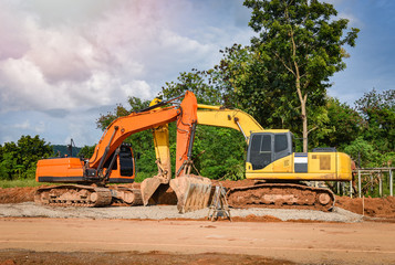 road construction with backhoe loader / yellow tractor loader backhoe