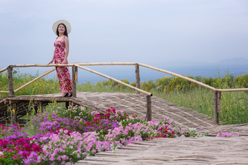 Beautiful woman in nature flower.