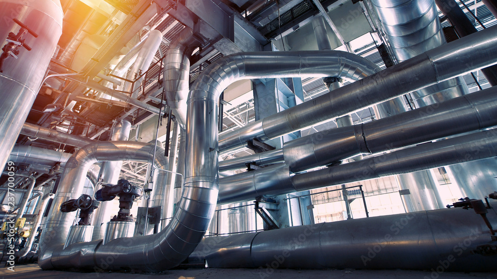 Wall mural equipment, cables and piping as found inside of a modern industrial power plant