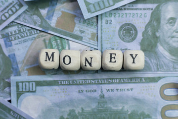 money word on wood brick  background banknote.