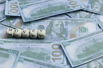 money word on wood brick  background banknote.