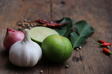 Vegetable herbal raw food  the ingredients for Asian meal on wood background