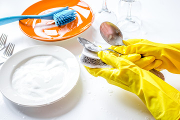 concept of woman washing dishes on white background